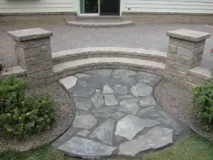 A stone pathway leading to a house.