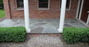 A stone patio with pillars.