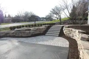 Paved driveway with Natural stone retaining walls