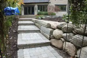 Paved walkway with natural stone retaining walls