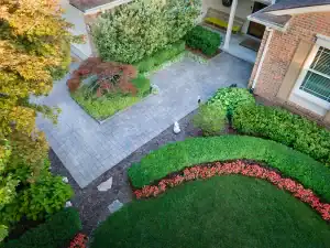An aerial view of a home with landscaping.