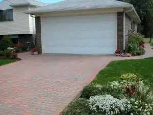 Driveway paving with brick-style concrete for outdoor home improvement.
