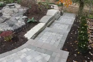 Beautiful stone paved garden pathway with landscaping details.