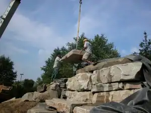 Outdoor stone installation and landscaping services.