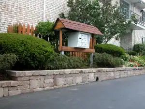 Apartment complex with landscaping around mailbox