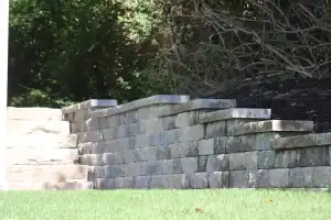 Natural stone retaining wall with steps.