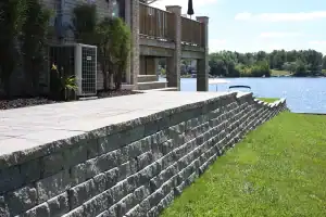 Stone retaining wall on lakefront.